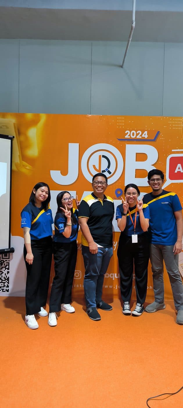 Kuya Aries and his team at a 2024 job fair booth